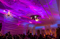 This photo shows two of our laser lumia systems washing a ceiling for a fundraising gala at a historical museum.