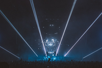 This photo captures a moment during a live concert in which lasers were programmed in sync with the show’s video elements; giving life to a spinning "nuclear reactor".