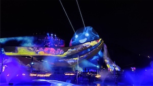 <b>Animo:</b> A simple and powerful laser effect adds 3D life to the animated theme park character. Two lasers from different angles are used to project onto the building creating the impression that the beams are actually projecting out from the eyes.