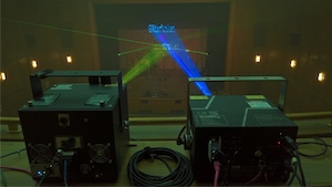 <b>Ode to Joy Laser Beams (Behind the Scenes):</b> This photo was taken at a rehearsal for an event to be performed at the end of May 2020. Unfortunately, due to the COVID-19 limitations, the event was cancelled. The photo point of view is from behind the two graphics projectors that have been used.